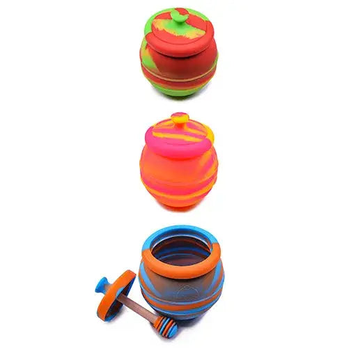 Three jumbo honey pot silicone containers with colorful striped lids and dipper