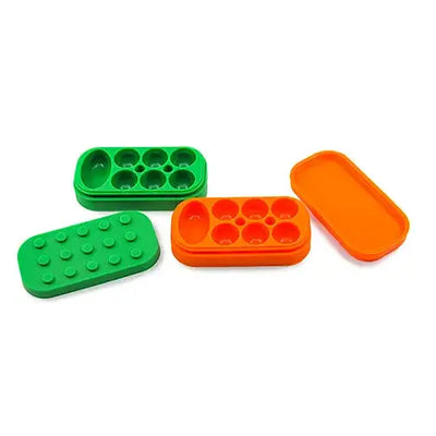 Lego-style silicone container in bright green orange for dabber’s dream