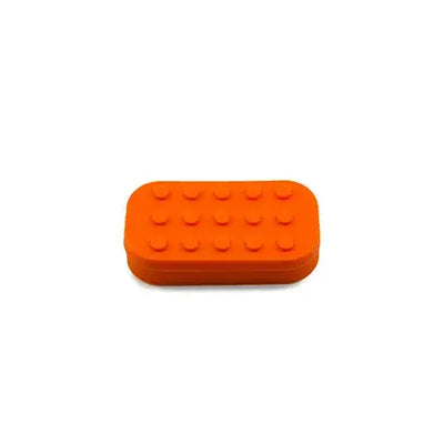 Bright orange Lego-style silicone container for dabber’s dream