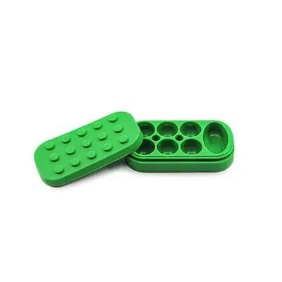 Green Lego-style silicone container for Dabbers Dream with dotted lid
