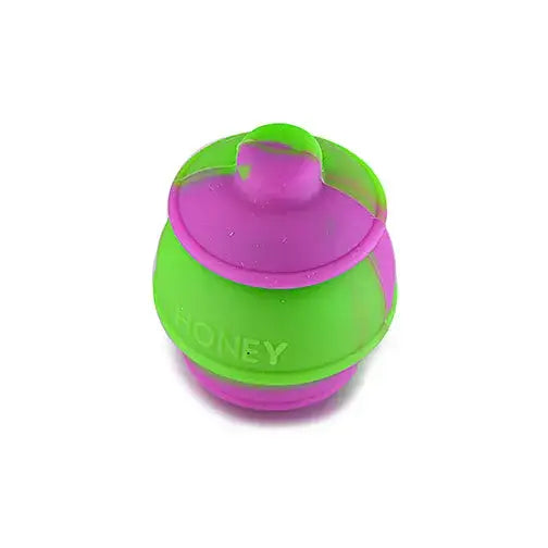 Vibrant mini honey pot silicone container in green and pink with honey embossed