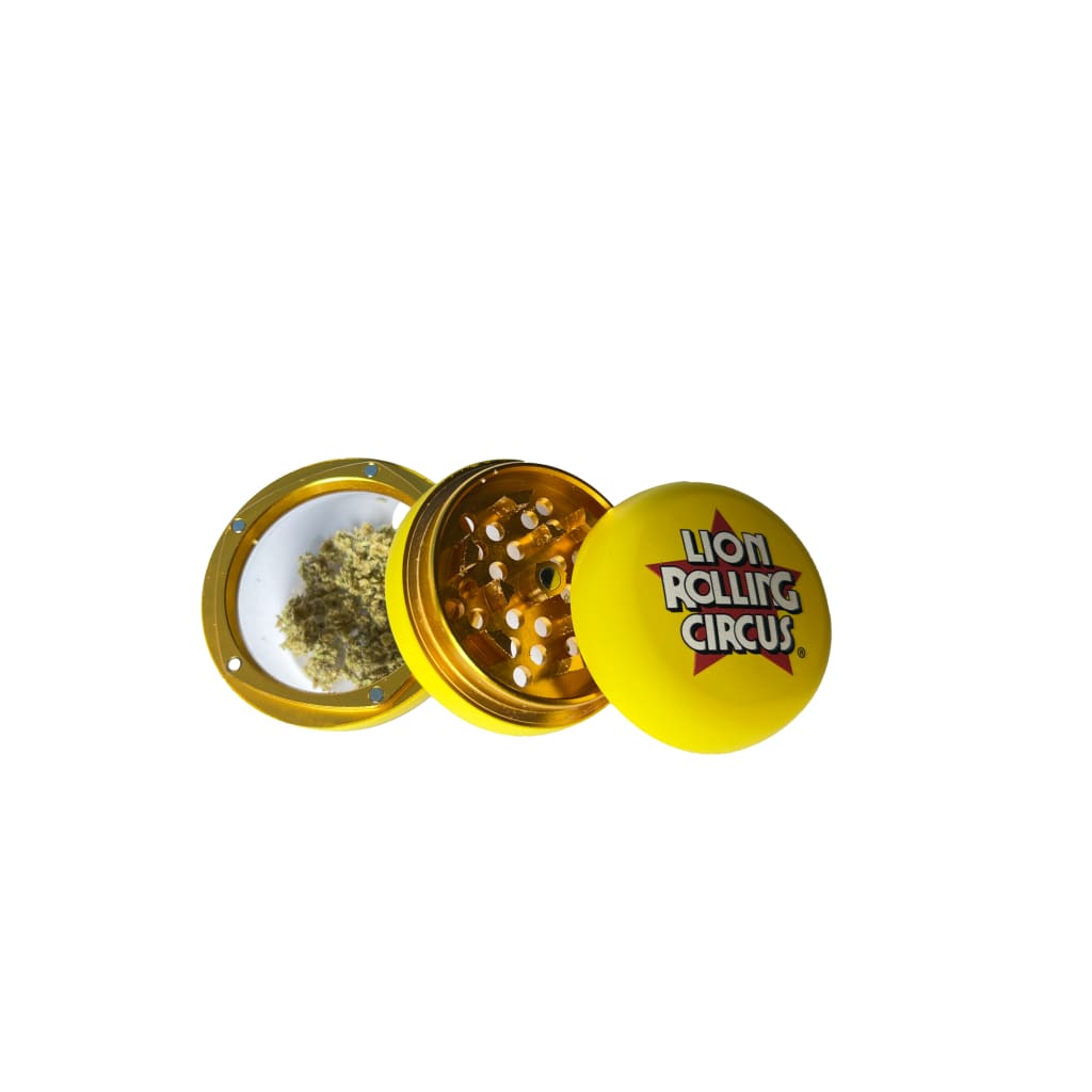Nuevo Grinder: Durable three-piece metal herb grinder with ’Lion Rolling Circus’ branding