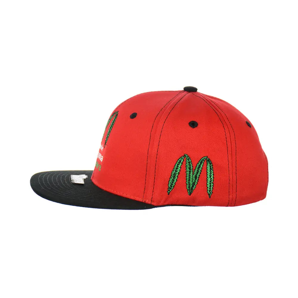 Red and black embroidered snapback hat with green leaf embroidered logo on 100% cotton