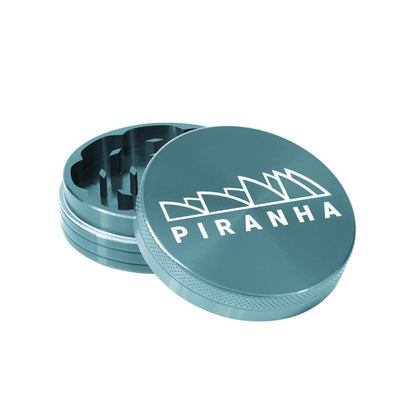 Teal Piranha aluminum grinder for dry herbs: Compact, durable, 4-piece grinding efficiency