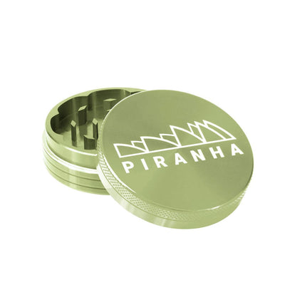 Compact Piranha Aluminum Grinder For Dry Herbs with ’PIRANHA’ branded metal herb grinder lid