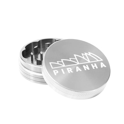 Compact Piranha aluminum piece grinder for grinding dry herbs