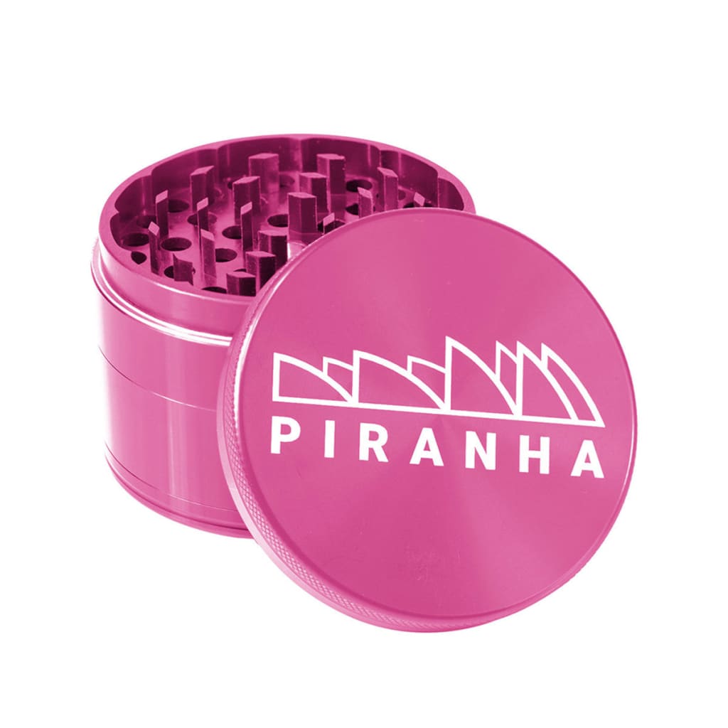 Pink Piranha aluminum grinder with razor sharp teeth and strong magnetic lid
