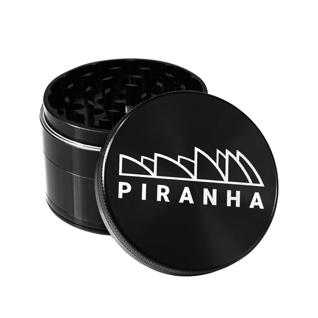 Black Piranha aluminum grinder with razor sharp teeth and strong magnetic lid