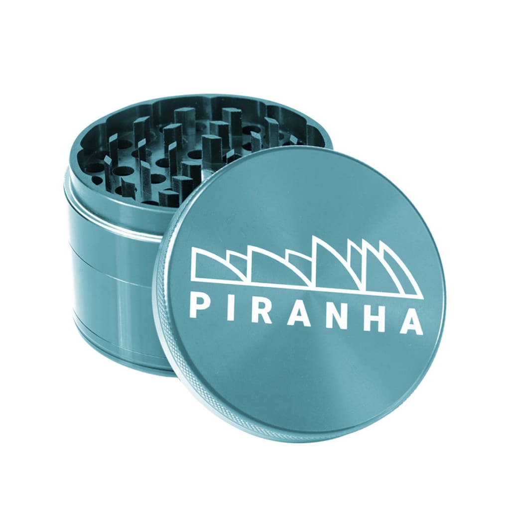 Teal Piranha aluminum grinder with razor sharp teeth and strong magnetic lid