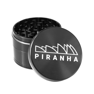 Black Piranha aluminum grinder with razor sharp teeth and strong magnetic lid