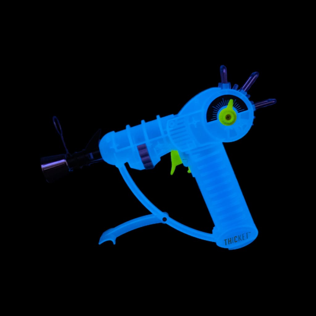 Bright blue handheld tattoo machine with neon green accent - Real Life Ray Gun Torch