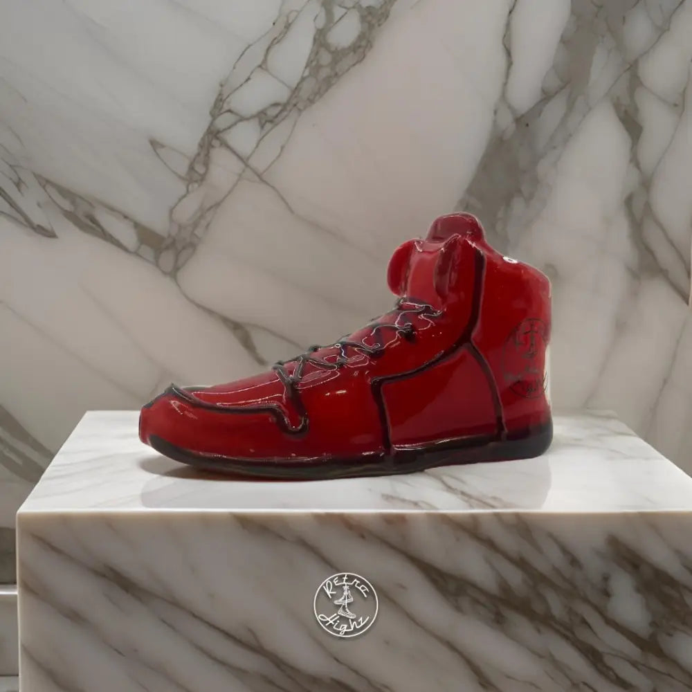 Red high-top sneaker sculpture, part of Retro Highz glass hand pipe collection, is a unique glass water pipe design