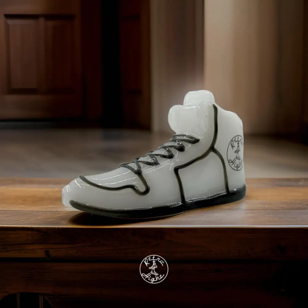 Translucent sneaker sculpture on Retro Highz Glass Hand Pipe showcasing glass water pipes