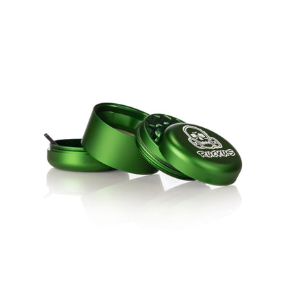 Green metal herb grinder with skull design from Lion Rolling Circus for hemp wraps and dabbing