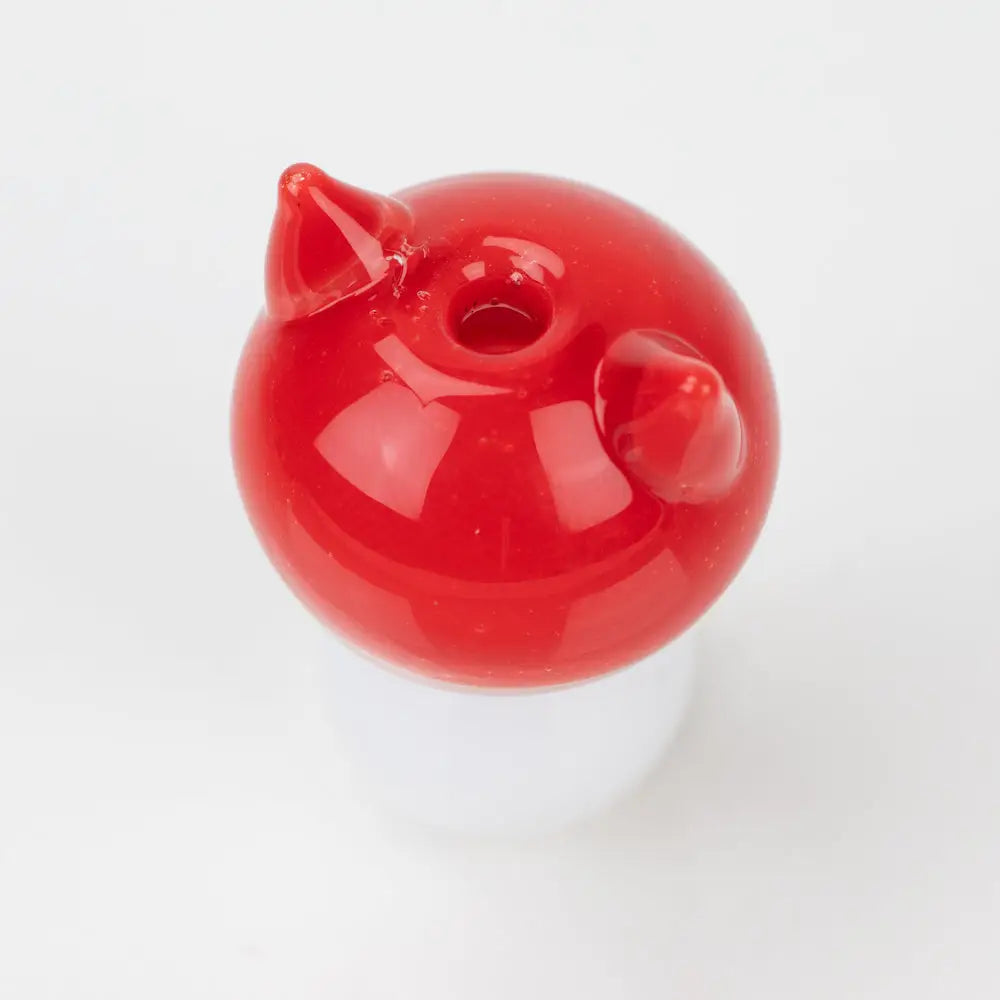 Vibrant red Sakibomb kitty head carb cap with glossy finish and horns