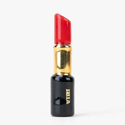 Glossy sakibomb red lipstick chillum with gold luci branding