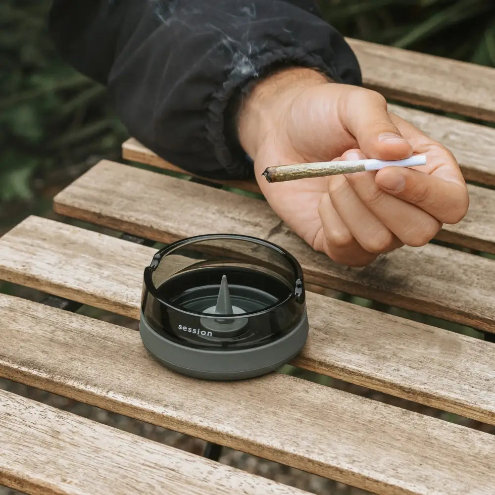 Session goods ashtray: black and gray circular design with central spike