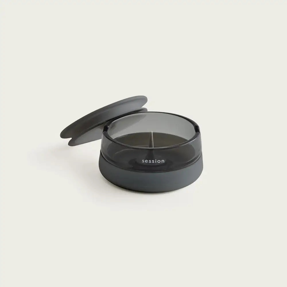 Session Goods ashtray: dark gray translucent plastic pill organizer with lid and divider