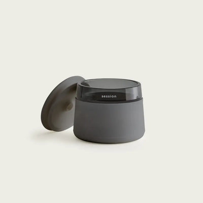 Session Goods stash jar in sleek matte gray ceramic with glass rim