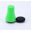 Bright green silicone magnetic cleaner for glass water pipes with a black circular base