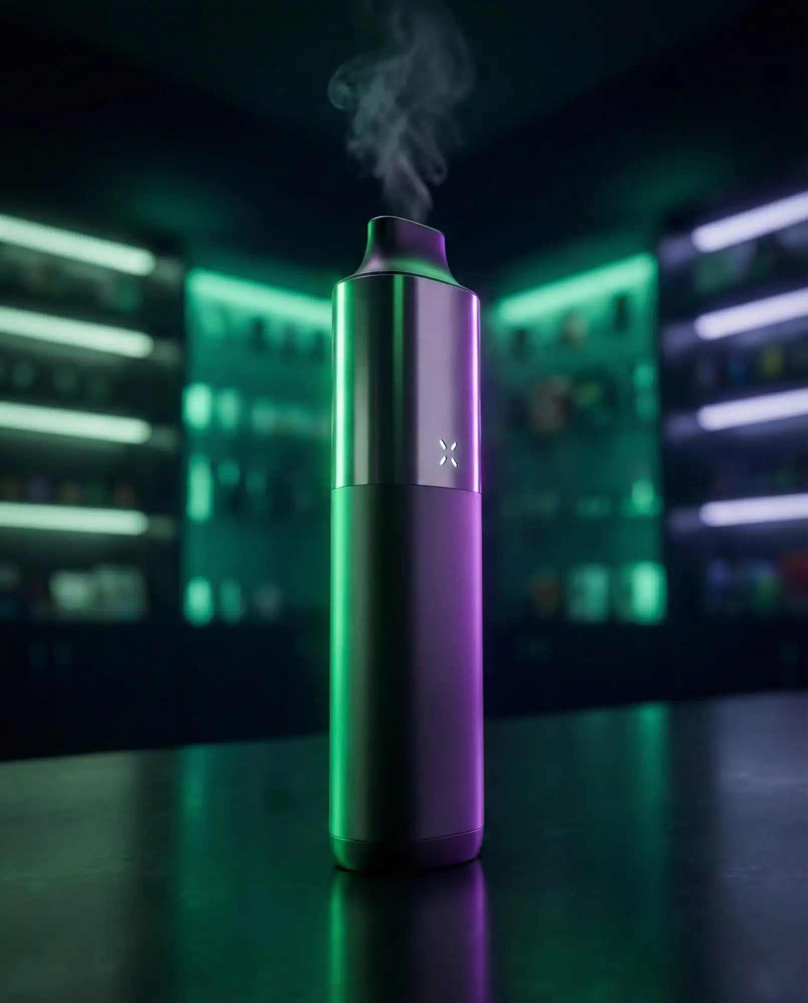 A sleek, cylindrical pax 3 vape pen with a metallic finish and gradient green-to-purple lighting.