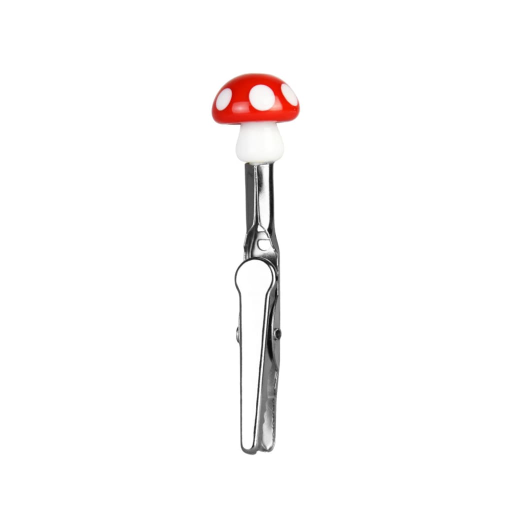 Glass memo clip with tongs featuring a red and white mushroom-shaped handle