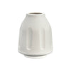 White ceramic vase with embossed design next to smokebuddy paper personal air filter for smoke removal