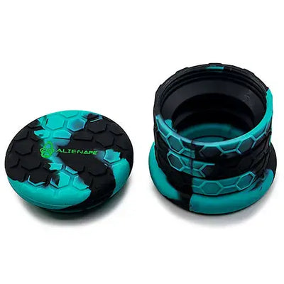 Teal black hexagonal silicone vape cap on Space King collapsible silicone jar