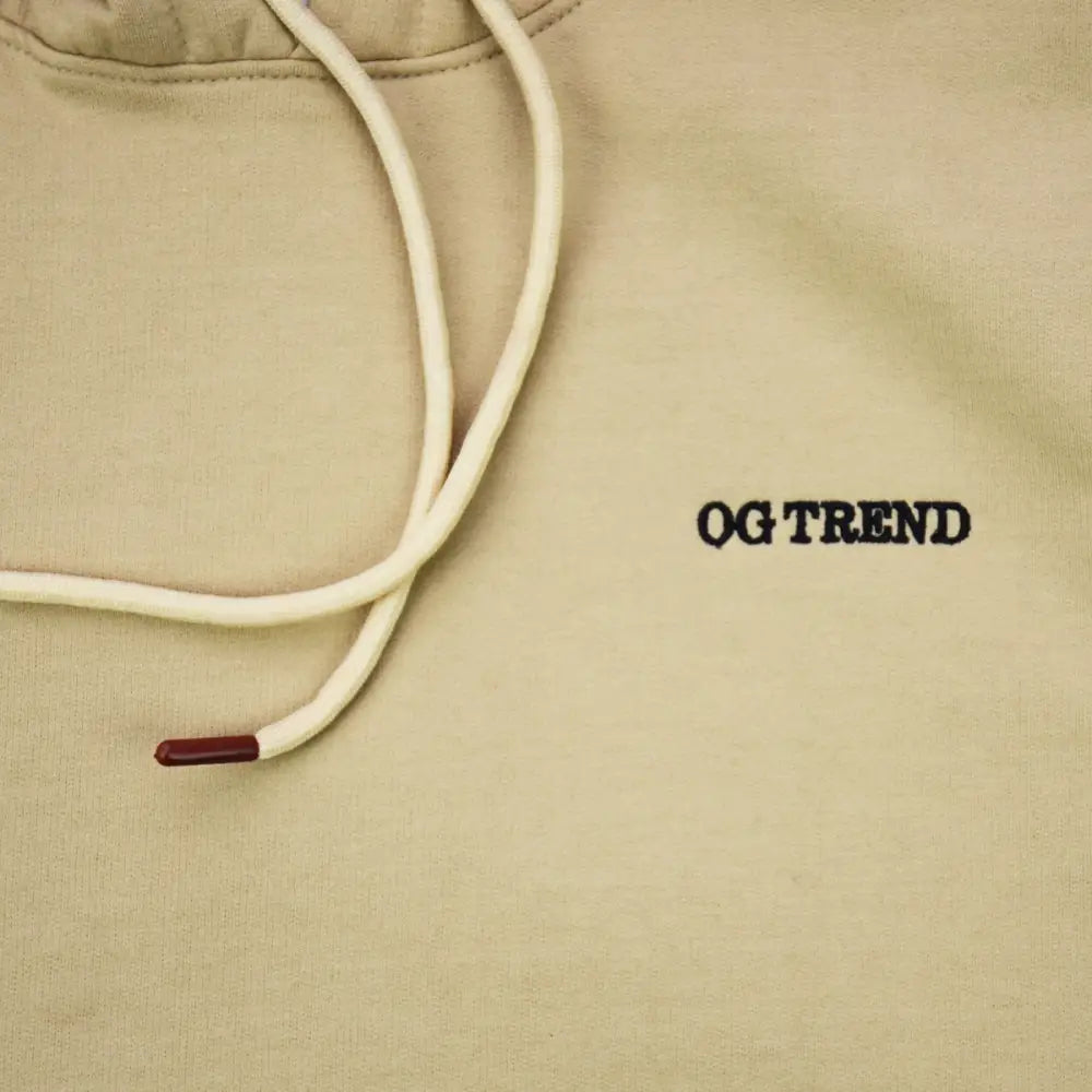 Beige Stay High Hoodie featuring OG TREND text and white drawstrings for ultimate comfort