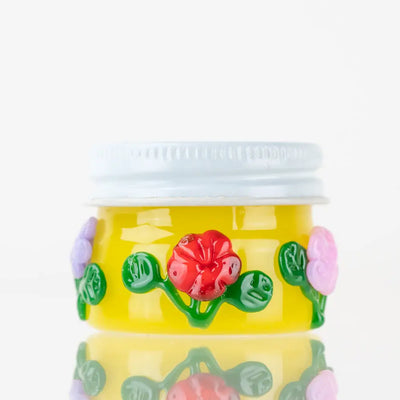 Sunshine Garden terp jar by Empire Glassworks: yellow floral glass jar
