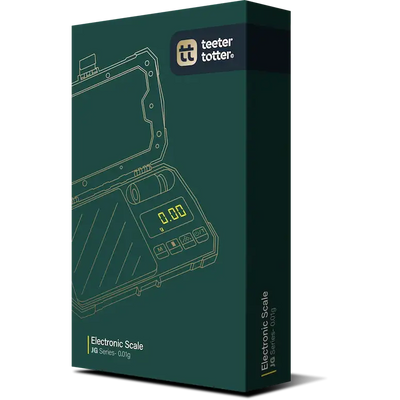 Teeter totter JG series 0.01g scale in dark green box showing 0.00