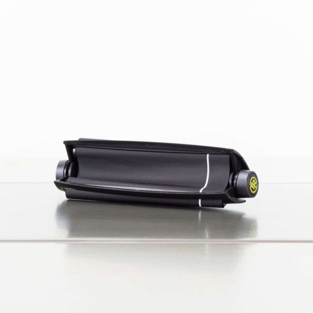 Black Cylindrical Electronic Device With Green Button Included In Futurola Essential Stoner Kit
