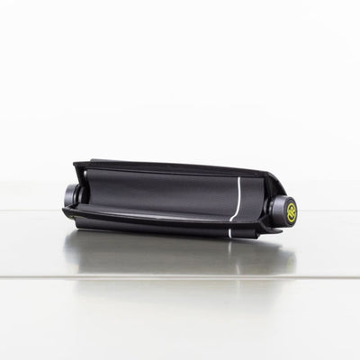 Black Cylindrical Electronic Device With Green Button Included In Futurola Essential Stoner Kit