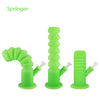 Three bright green Waxmaid Springer collapsible silicone water pipes with unique designs