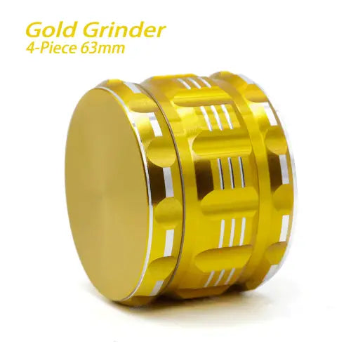 Gold-colored Waxmaid 4-piece Polygon Herb Grinder with geometric cutouts and silver edge design