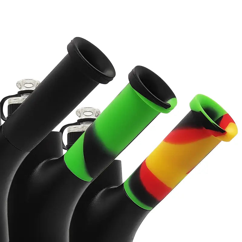 Three Waxmaid Ares silicone mouthpieces in black, green, rasta for dab rig