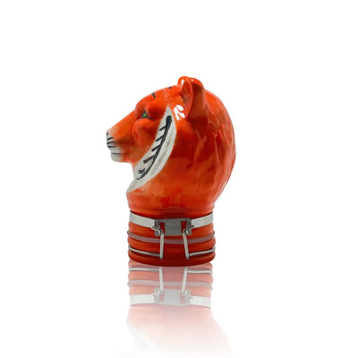 Orange tiger-shaped ceramic storage jar with striped collar for elegant home decor