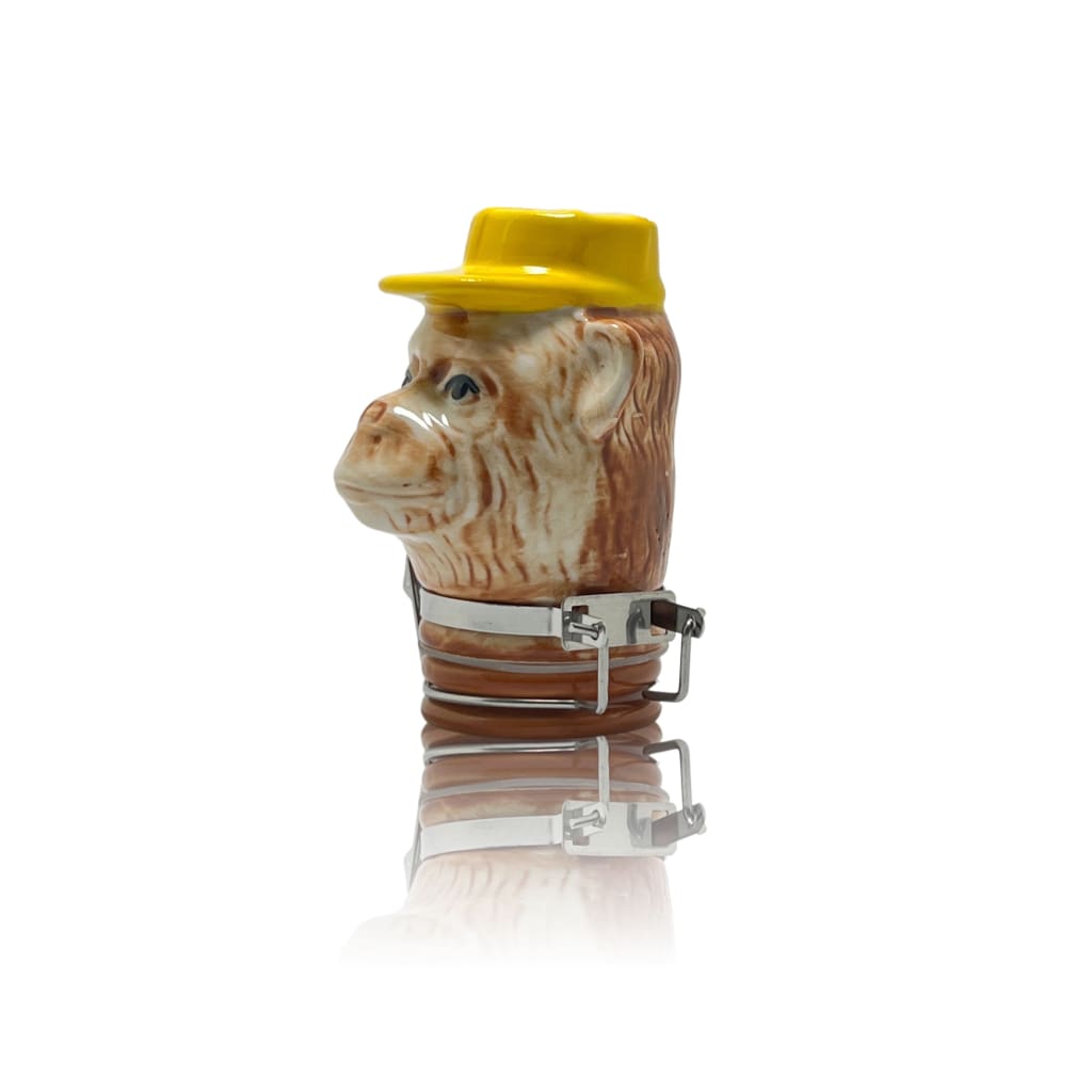 Ceramic monkey head bottle stopper with a yellow hat, ideal for ceramic storage jars and home decor