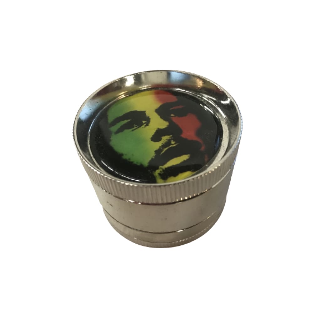 Bob Marley fine toothed metal grinder with colorful face design and pollen screen