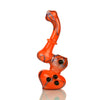 Color Frit Art Bubbler with Zigzag Lines: Bright orange glass pipe with black accents