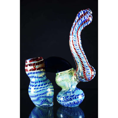 Double chamber glass bubbler with colorful swirling patterns and twisting smoke feature