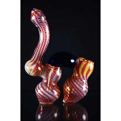 Double chamber glass bubbler with red and white twists, designed for smoke rolling slowly