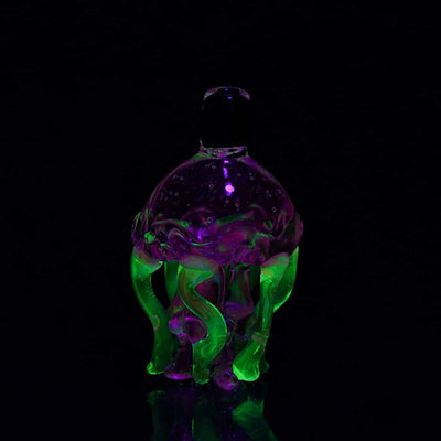 Empire Glassworks Jelly Fish Carb Cap UV Glass glowing with purple and green tentacles