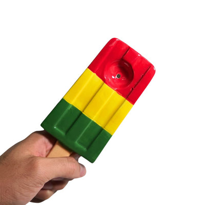 Ceramic ice pop pipe in vibrant rasta colors: a unique red, yellow, and green smoking accessory