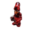 Red cartoon character figurine with spray paint can and ceramic water pipe