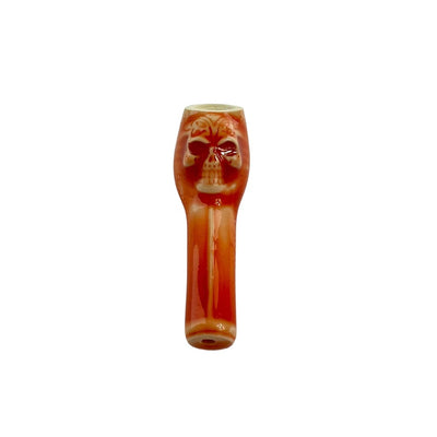 Reddish-orange skull-shaped Colombian ceramic pipe with smooth finishes for young smokers