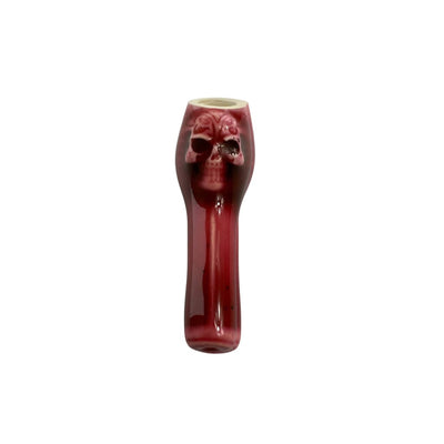 Red glass skull pipe from Colombian Ceramic Pipes with smooth finishes for young smokers