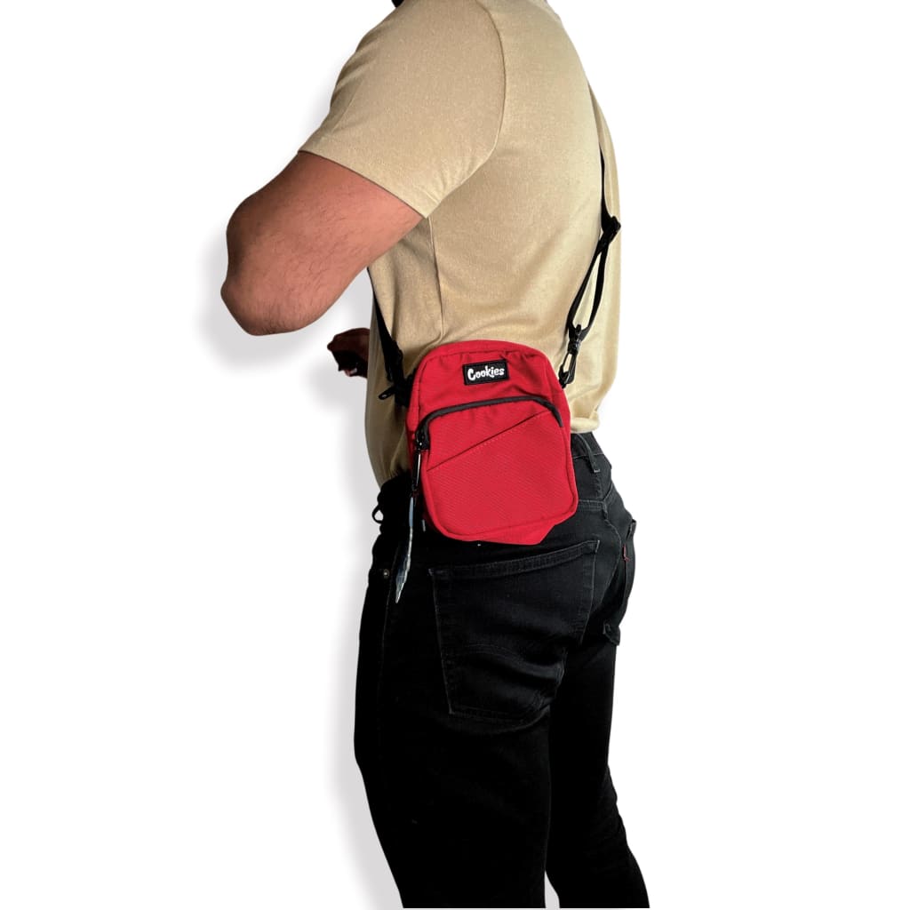 Red Smell Proof Clyde Shoulder Bag over beige shirt and black pants - Cookies Clothing