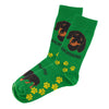 Pair of bright green dachshund novelty socks with yellow paw prints in cotton elastic blend