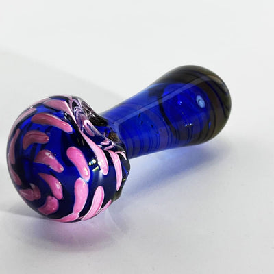 Blue glass pipe with pink swirls, featuring dichroic nightshade glass design